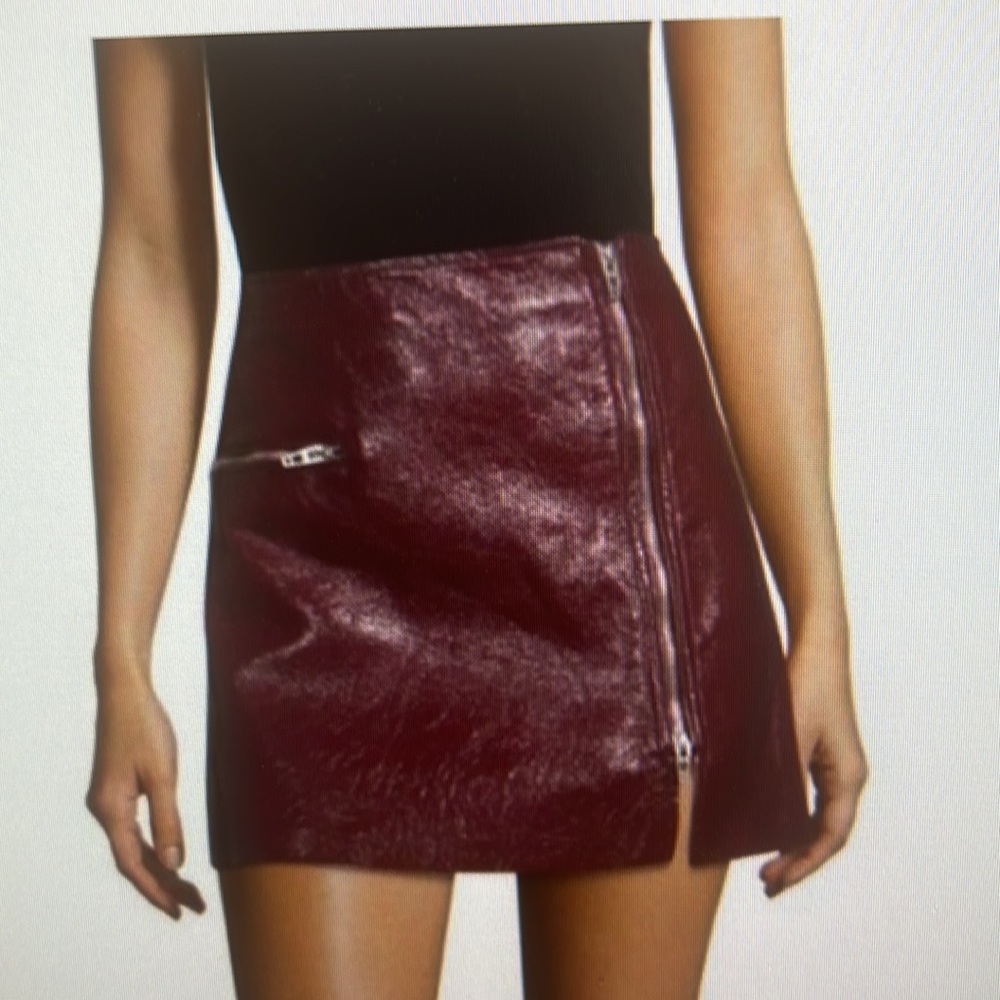 Maroon colored cute skirt — not too short. Perfect with boots and tights